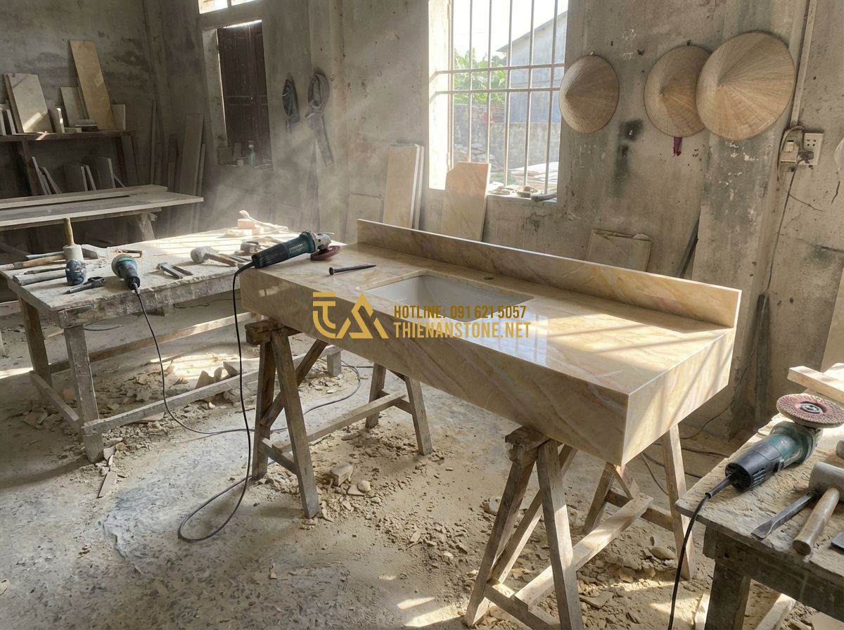 Top 15 Mẫu Bàn Lavabo Đá Tự Nhiên Đẹp Nhất Dành Cho Nhà Phố Và Biệt Thự - Tạo ảnh tiếng Anh: Inside a professional stone masonry workshop, skilled craftsm