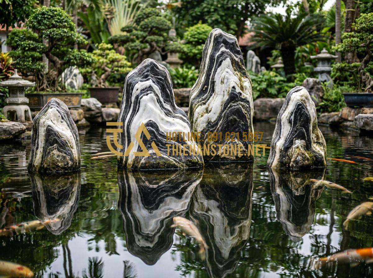 Top 5 địa chỉ bán đá Tuyết Sơn uy tín tại Hà Nội và TP.HCM - Snow Mountain stone in koi fish pond design showing clear water reflection and s