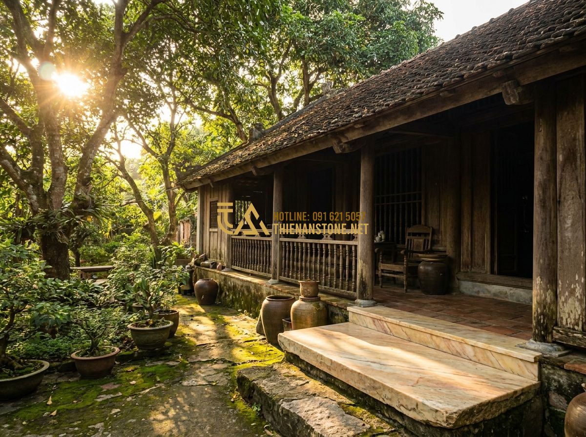 Ưu Nhược Điểm Con Tiện Đá So Với Con Tiện Sắt Gỗ Bê Tông: Nên Chọn Loại Nào? - Hình 1 Ưu Nhược Điểm Con Tiện Đá So Với Con Tiện Sắt Gỗ Bê Tông: Nên Chọn Loại Nào? - Tạo ảnh tiếng Anh: A nostalgic scene of an old Vietnamese traditional wooden hou
