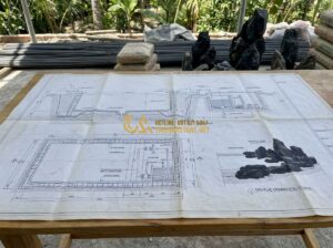 Vật Liệu Thi Công Hồ Cá Koi Nên Dùng Gì Để Độ Bền Trên 20 Năm? - Detailed architectural blueprint of a professional koi pond construction site, s