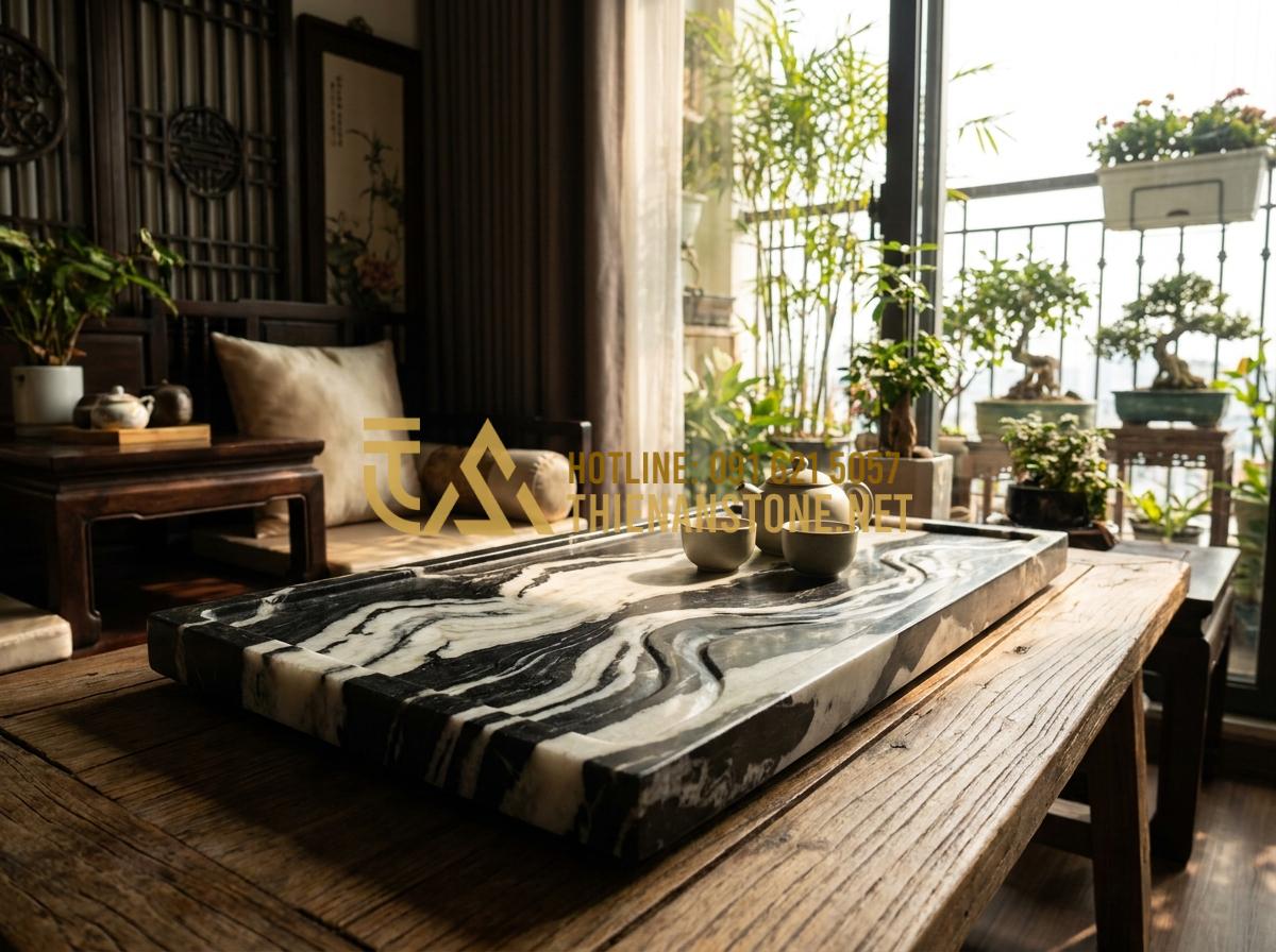 Ý Nghĩa Phong Thủy Của Khay Trà Đá: Cách Chọn Màu Đá Hợp Mệnh Gia Chủ - Stone tea tray positioned in the center of a Feng Shui living room facing south